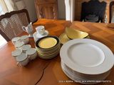 a table with a lot of plates and cups on it