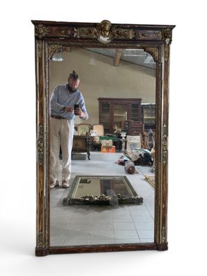 a man that is standing in front of a mirror