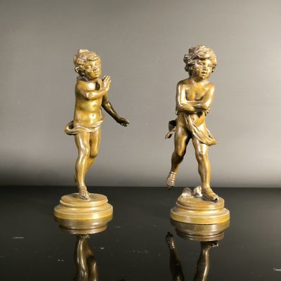 pair of antique bronze figurines of a boy and a girl