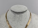 a gold necklace on a mannequin mannequin mannequin mannequin mannequin mannequin mannequin mannequin mannequin