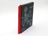 a black and red book with a drawing of a robot on it
