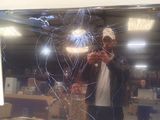 a man taking a picture of himself in the mirror