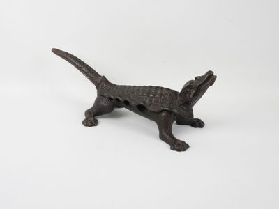 an old cast iron dog figurine on a white background