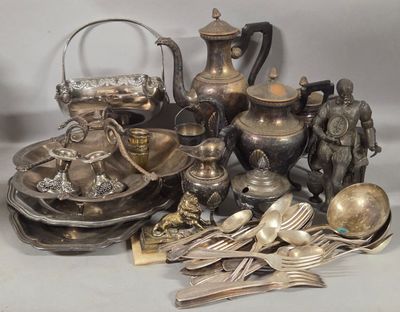a lot of silverware and silverware on a table