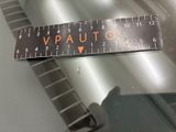 a close up of a piece of metal with a ruler on it