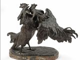 une statue représentant deux oiseaux qui se disputent l'un l'autre