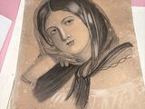 a drawing of a woman on a piece of paper on a table