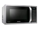 a silver microwave oven with a digital clock on it