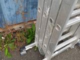 a close up of a metal fence with a brush in it
