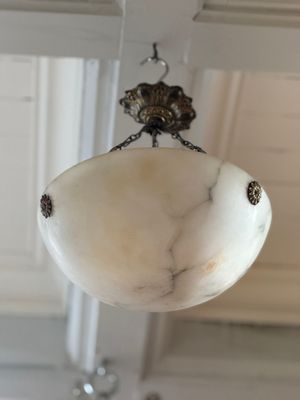 a light that is hanging from a ceiling in a room