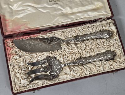 a silverware set in a red case on a table