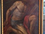 une photo d'un tableau représentant un homme agenouillé par terre