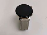 a smart watch sitting on top of a white table