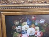 a picture of a painting of flowers in a gold frame