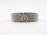 an 18k white gold and diamond bracelet watch