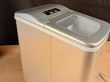 an image of a portable ice maker sitting on a table