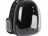 a black and white picture of a small space helmet