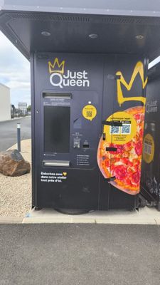 a vending machine that has a pizza on it