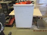 a white board with writing on it in the middle of a room