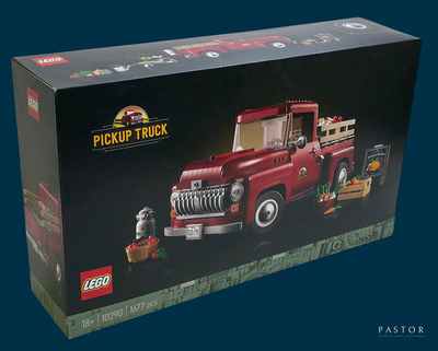 a box with a toy truck in it on a blue background