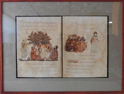 two framed pictures of a couple of people sitting under a tree