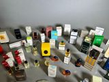 a lot of different types of perfumes on the table