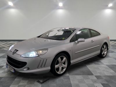 a picture of a silver car parked in a garage