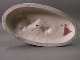 a white porcelain object with a face on it