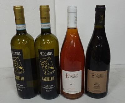 several bottles of wine are lined up on a table