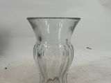 a glass vase that is sitting on a table