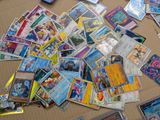 many different types of pokemon cards on the table