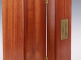 a pair of wooden boxes with brass hardware on each side