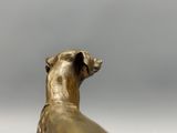 a statue of a dog with a collar on it