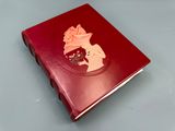 an image of a red book with a picture of a woman on it