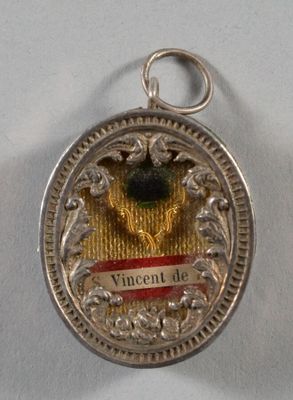 une image représentant une médaille d'argent sur laquelle figure l'effigie d'un oiseau