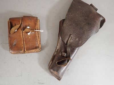 a small box and a leather case on a table