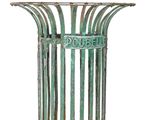 a metal trash can with a green patt on it