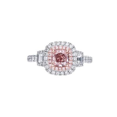 a pink and white diamond ring with two rows of diamonds