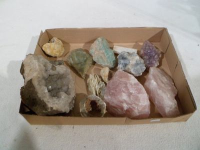 a box full of different kinds of rocks on a table