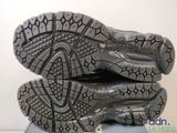 the soles of a pair of running shoes on top of each other