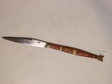 a knife that is laying on top of a table