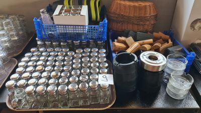 a table with a lot of bottles and containers on it