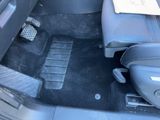 a picture of the inside of a car with the floor mats removed