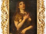 un vieux tableau représentant une femme tenant un chat, dans un cadre doré