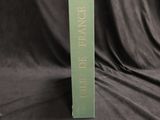 a picture of a book with a green cover on a black background