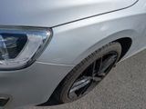 a close up of a car ' s headlight and front bumper