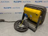 a yellow and black air compressor sitting on top of a table