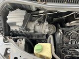 a close up of a car ' s engine with the hood open