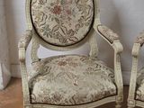 pair of upholstered chairs with floral upholstered back and arms
