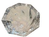 a glass bowl that has a silver design on it